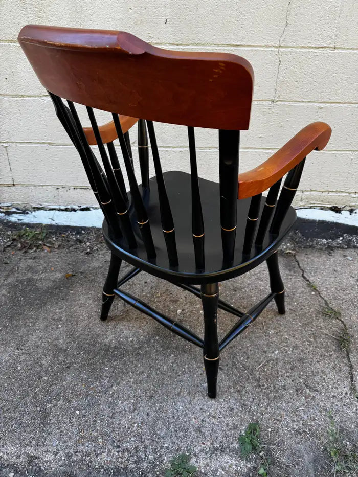 windsor armchair with curved back and carved seat emblem