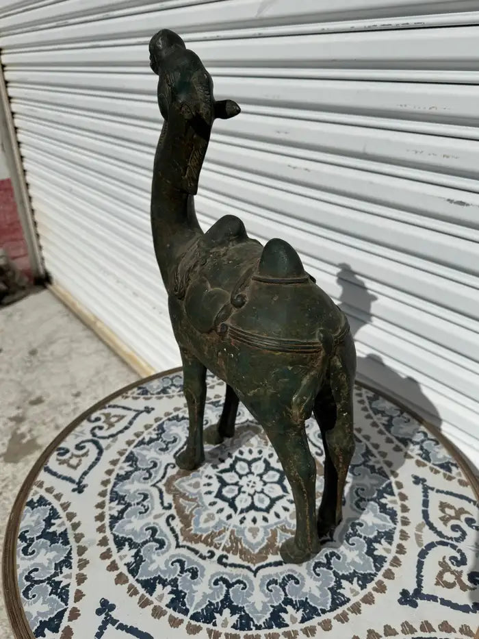 large bronze camel figurine with aged patina texture