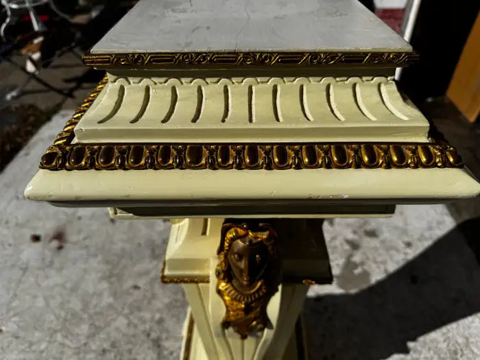 classical pedestal stand with carved motifs and bronze ormolu