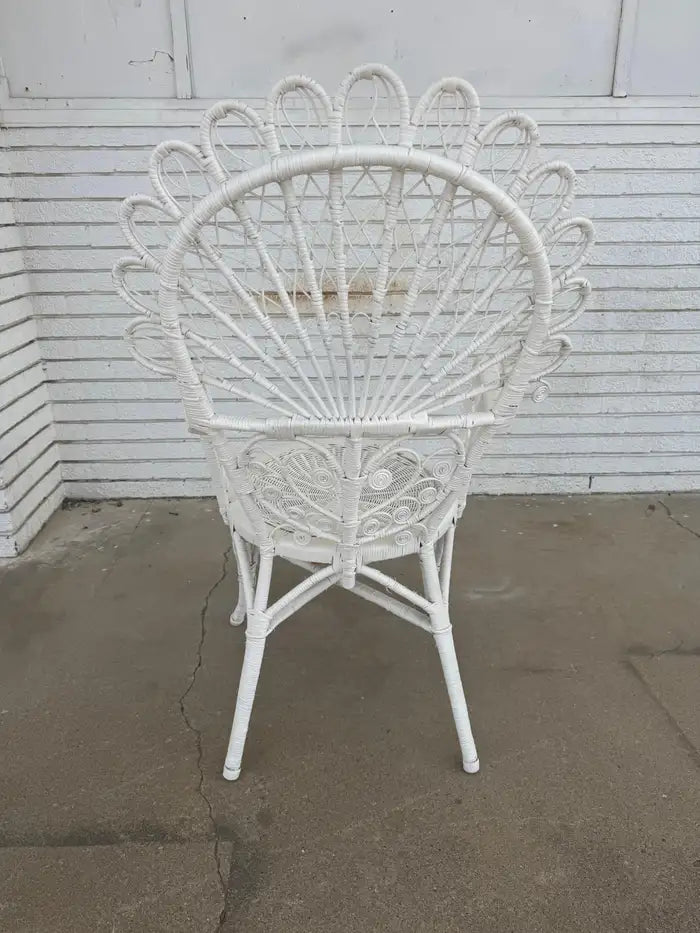 woven wicker chair with painted finish and sturdy frame