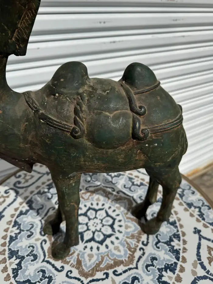 patinated bronze camel sculpture on marble base