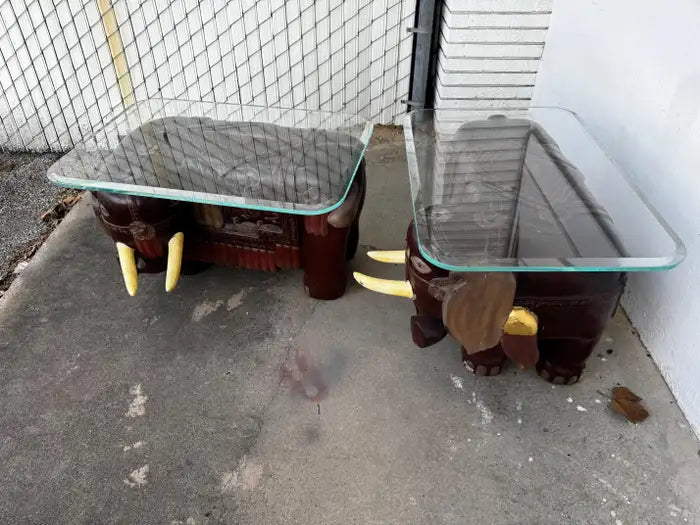 elephant sculpture tables with glass top and carved details