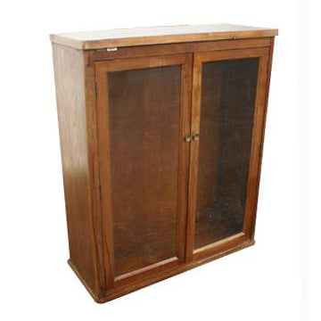 Vintage bookcase with glass doors used as a display cabinet for books and décor