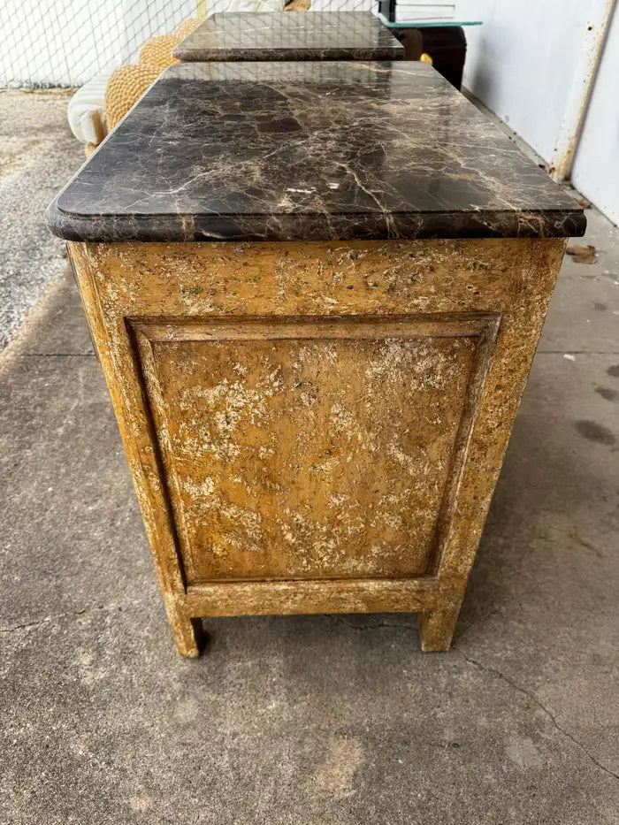traditional marble top cabinets with carved details and storage drawers
