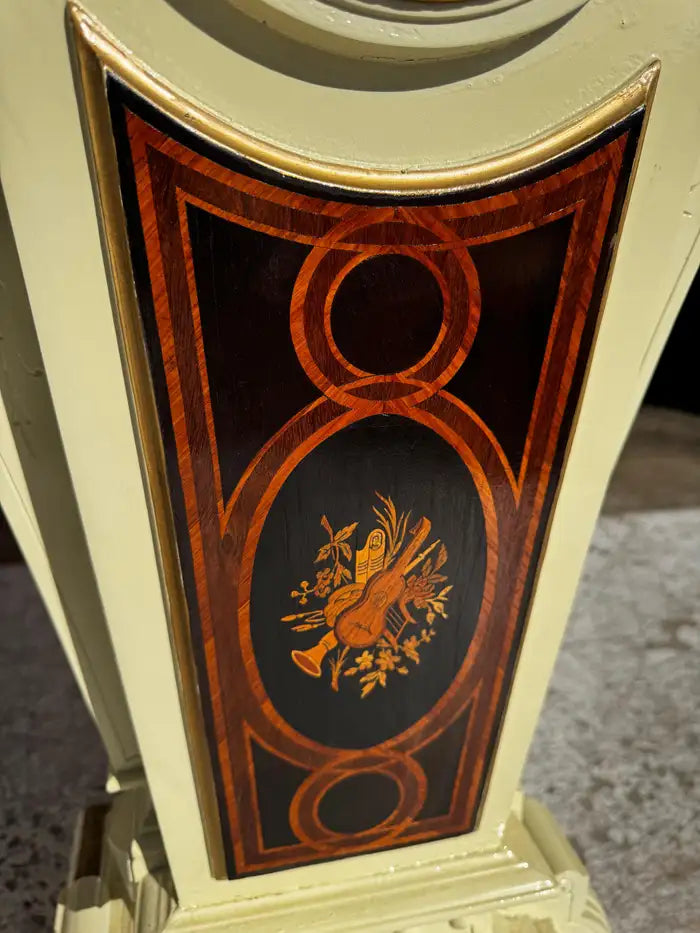 decorative carved pedestal with gilded bronze trim detail