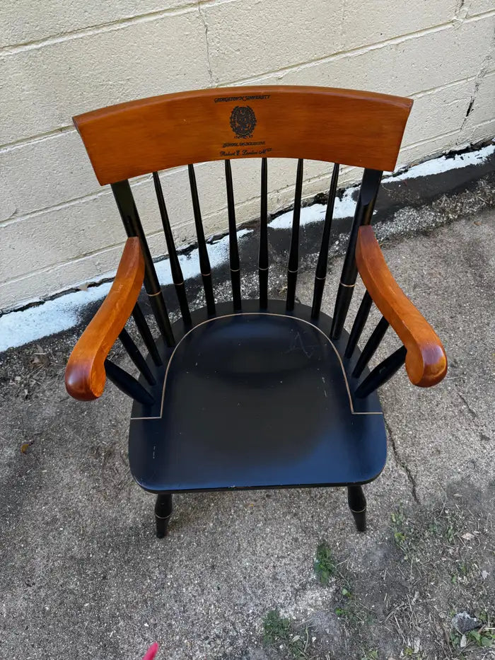 windsor armchair with curved backrest and wood seat