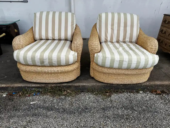 woven wicker lounge chairs with plush seat and back cushions