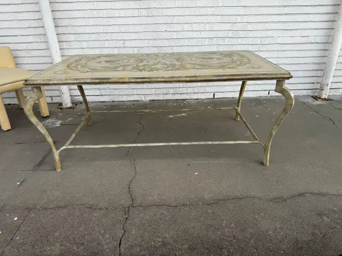 decorative Italian iron table with scrollwork and wood surface